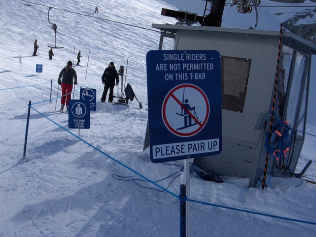 "Please pair up" sign