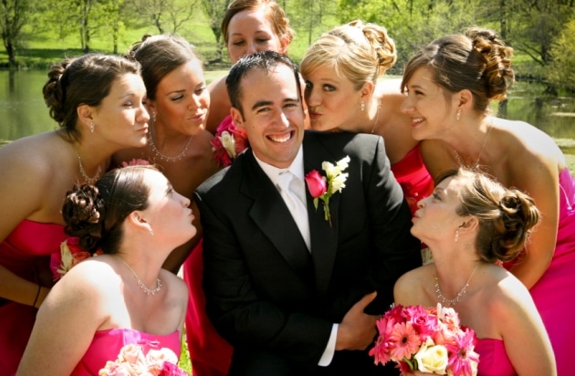 Bridesmaids kissing the groom