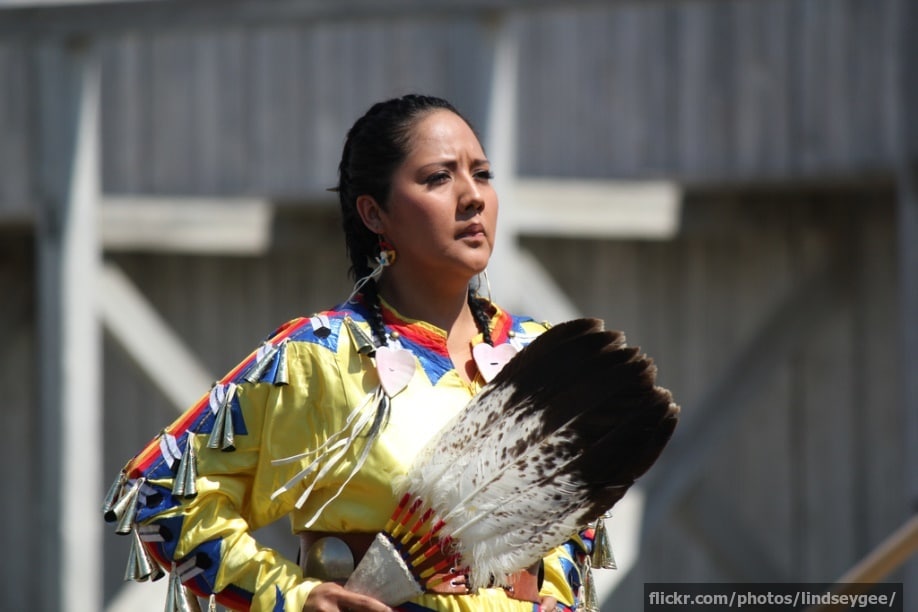A young Native American woman doing a rain dance