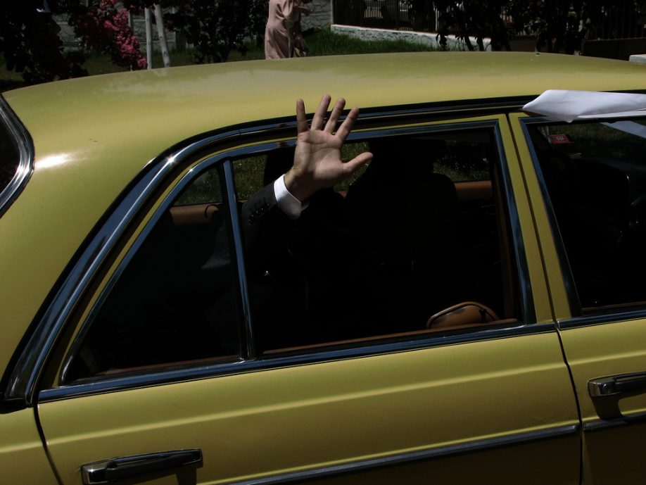 Hand waving from a car
