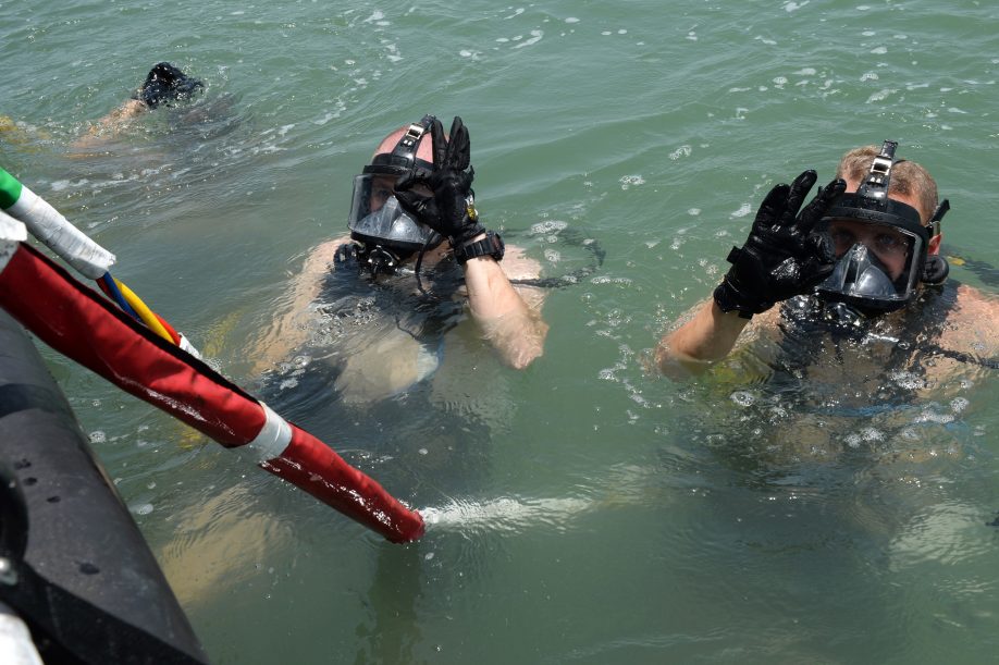 Scuba divers giving the OK sign