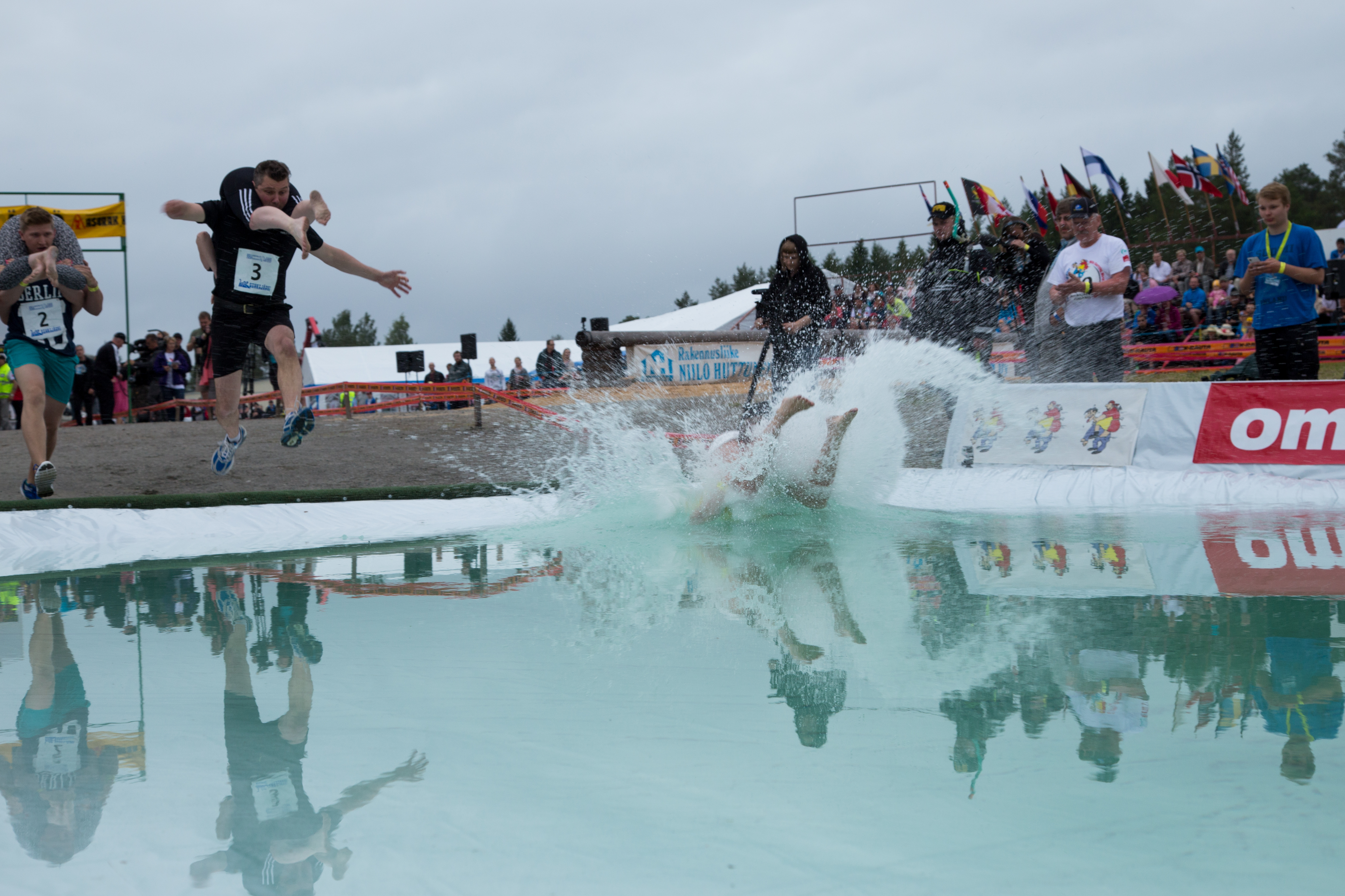Competitors in the world wife carrying championship