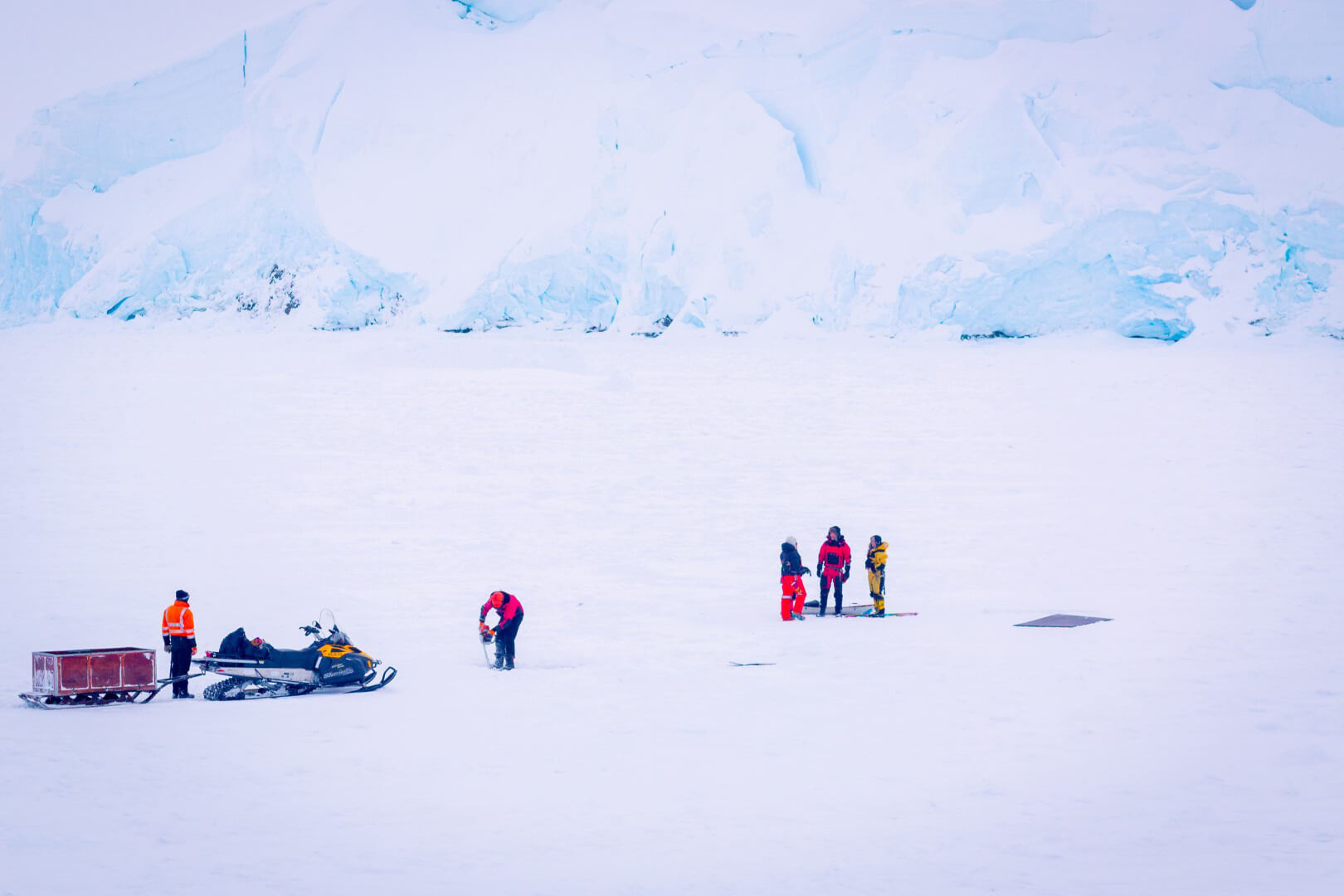 Cutting dive holes on the ice (Large)