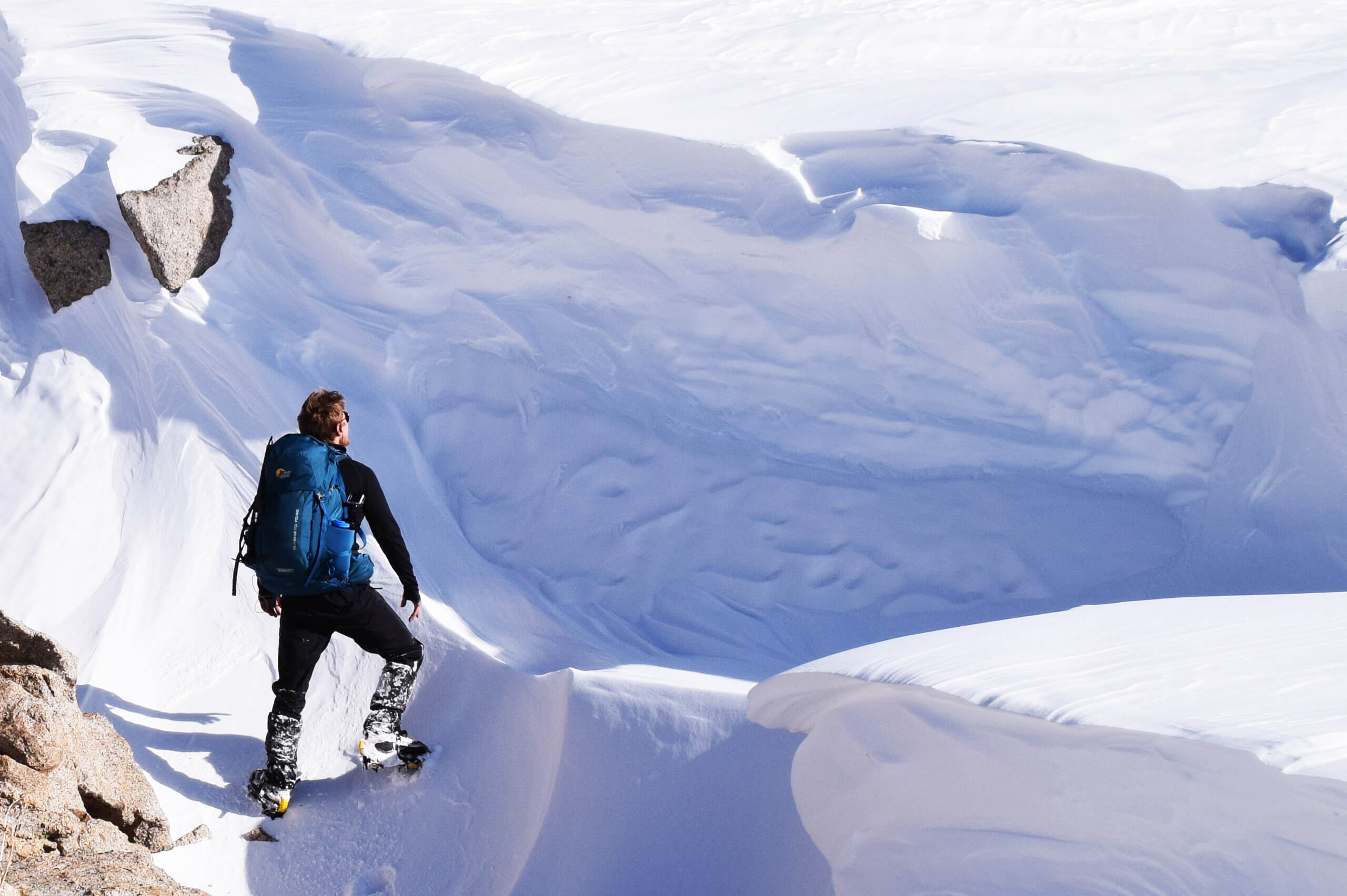 Navigating through towering snow drifts in the mountains of Kazakhstan