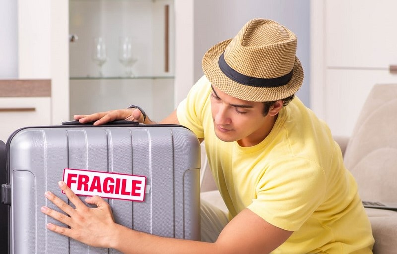 a suitcase with a fragile label