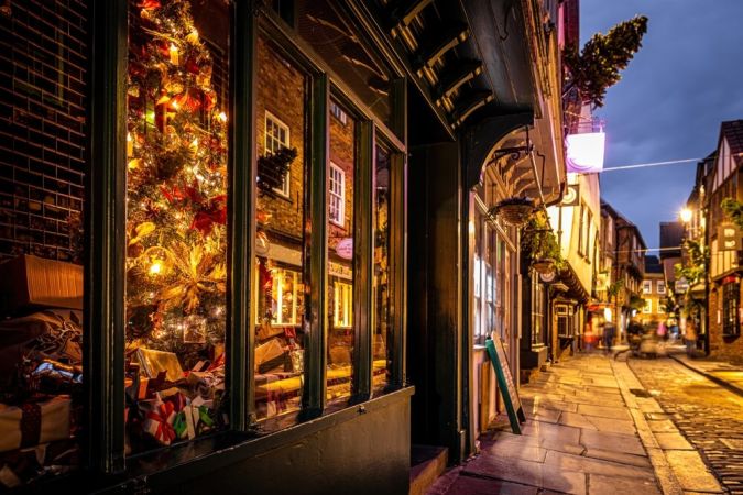 Picture shows York Shambles decorated for Christmas. It is warm and inviting.